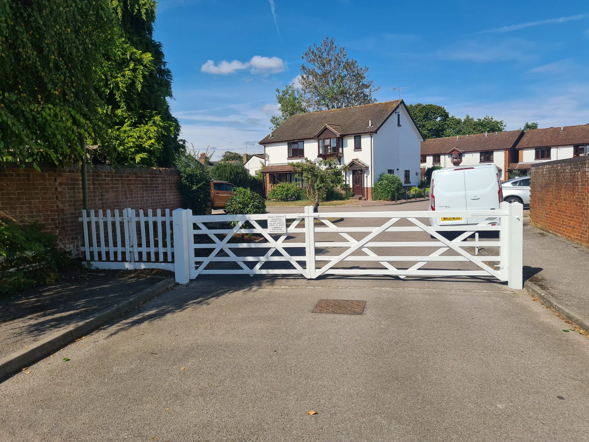 white gate in front of a house