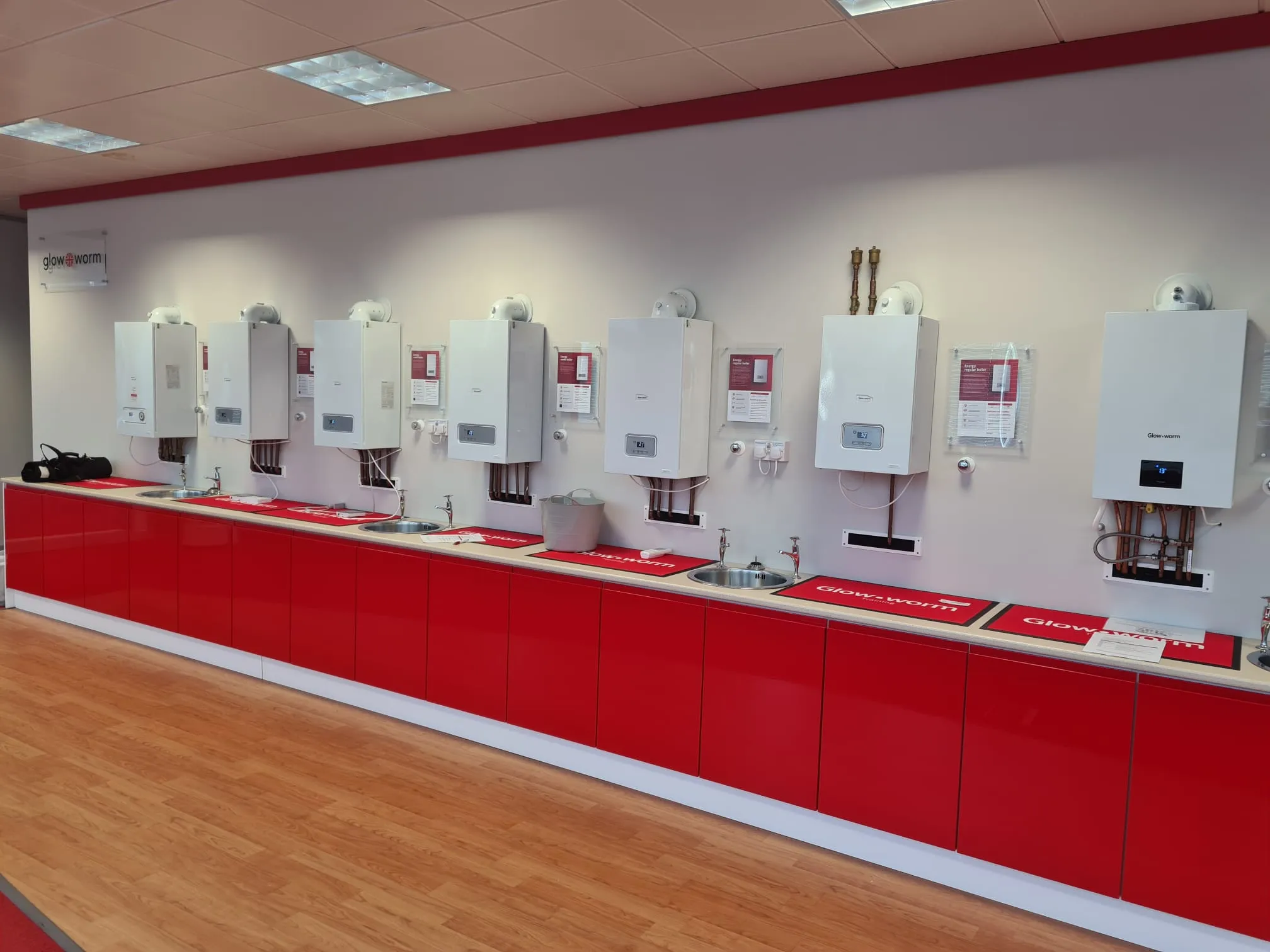 red cabinets in a room with white appliances